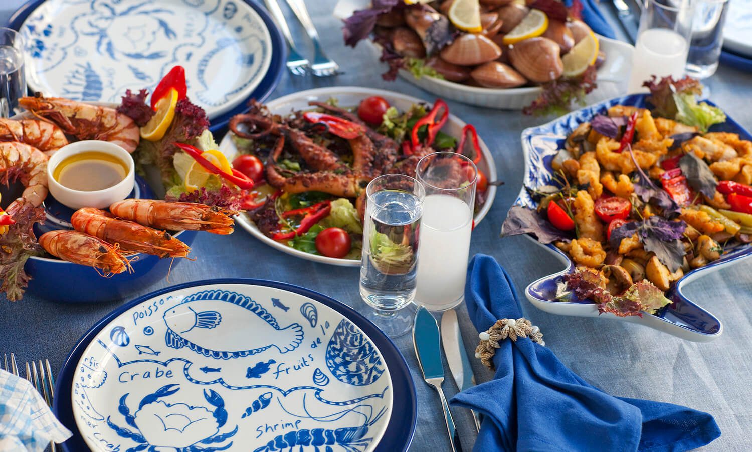 Seafood dishes served at a dining table